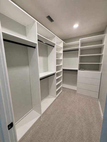 Custom walk-in closet with hardwood shelving